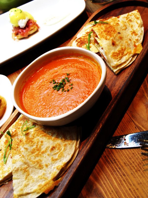 Creamy tomato soup with grilled cheese tortillas in a Tray