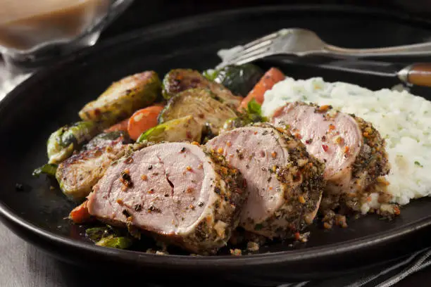 Pork Tenderloin Oven Baked Served With Rice in a Dish