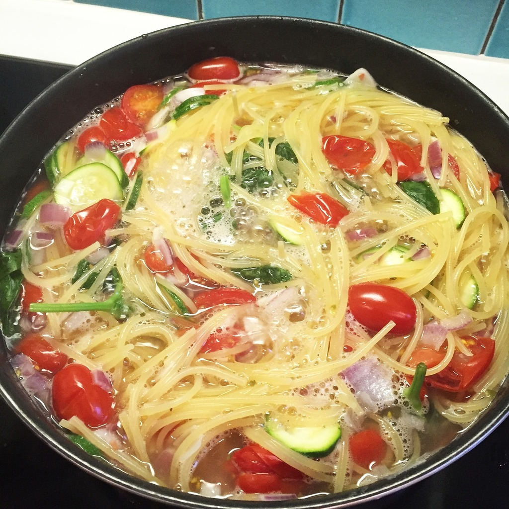 One-Pot Pasta Primavera with some vegetables in a pot.