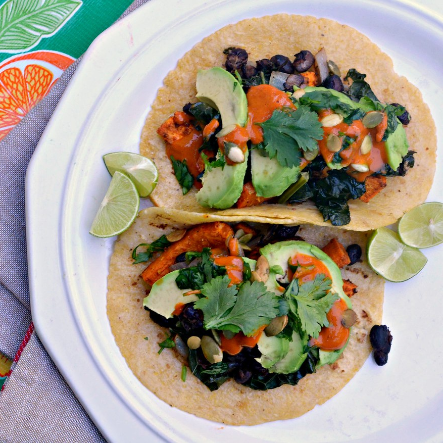 Black Bean Tacos with Some Lemon Wedges in a Dish