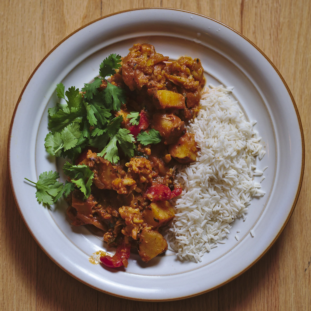 Cauliflower Tikka Masala served with rice in a dish