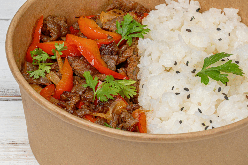 Stew Meat with rice and parsley in a bowl for lunch